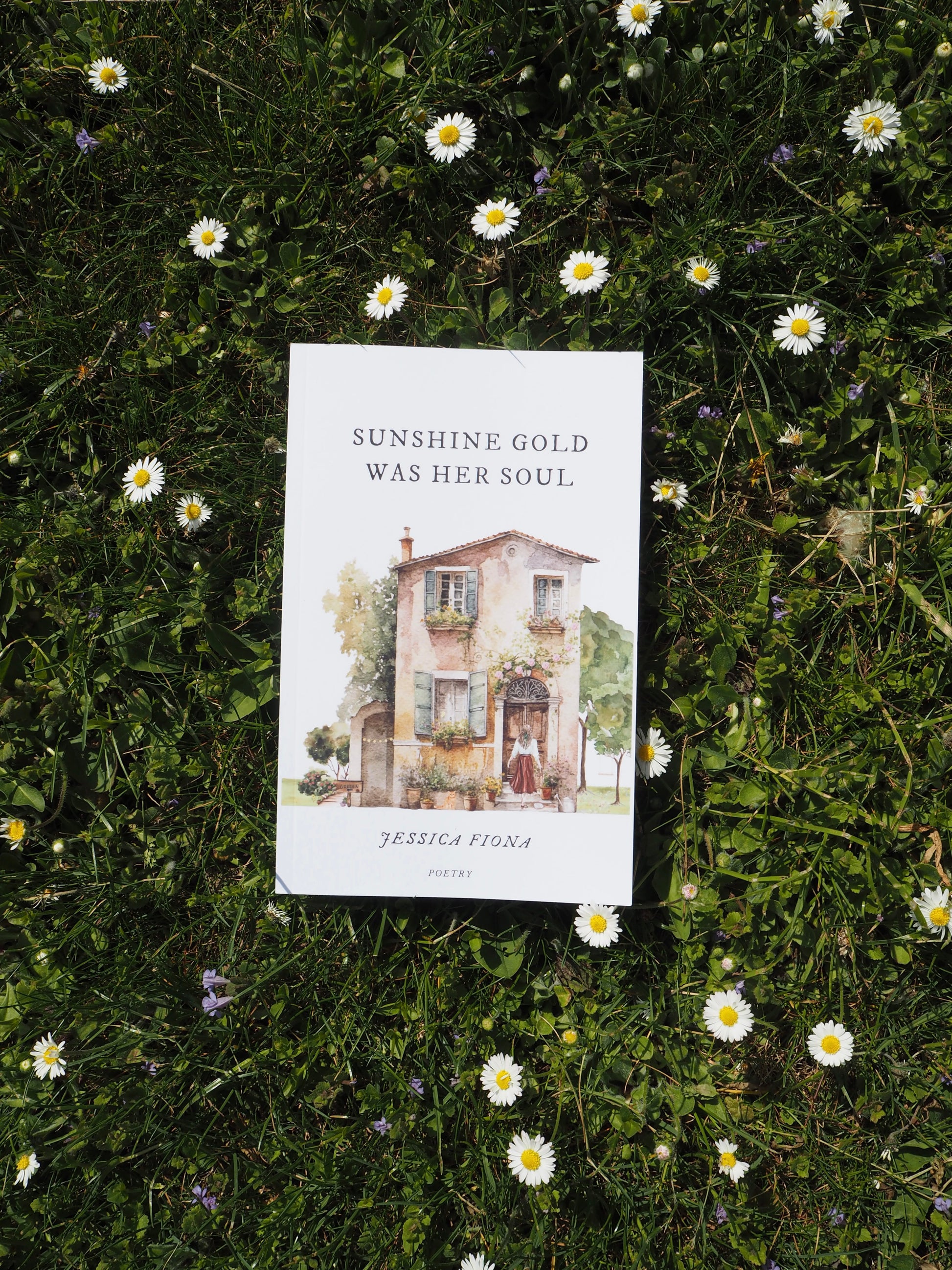 Poetry book sunshine gold was her soul lying between daisy flowers